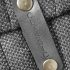 Leather clothing label says classic on black knit closeup